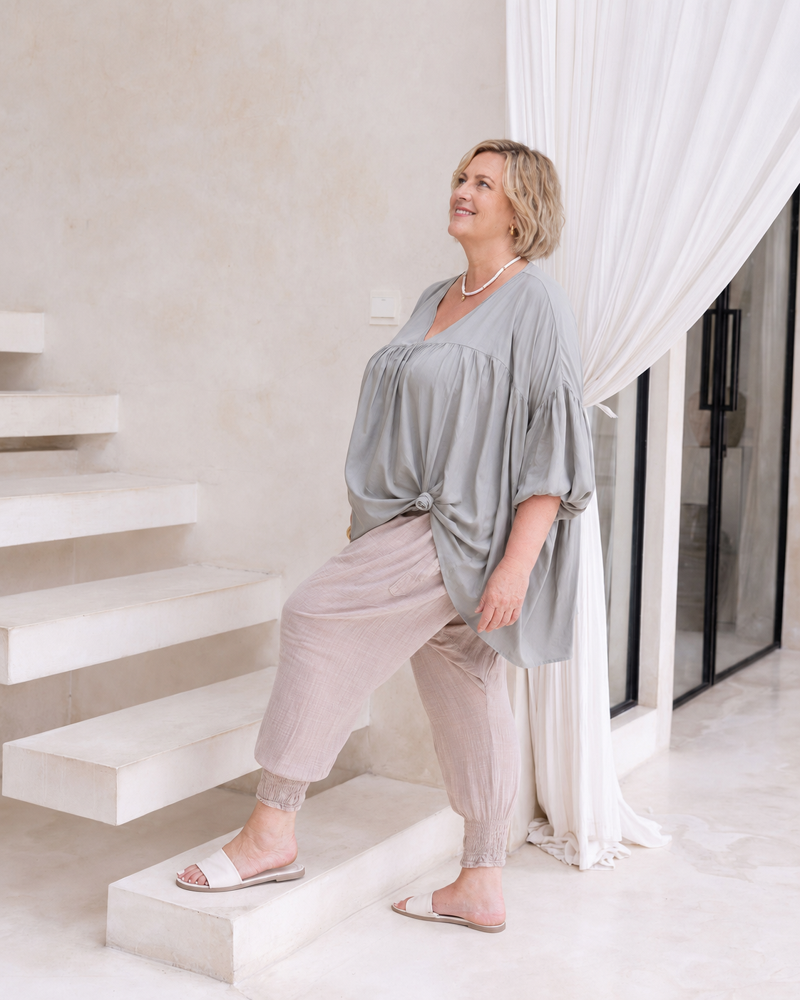 Woman wearing the Florence Top in Sage, relaxed oversized fit, boho style