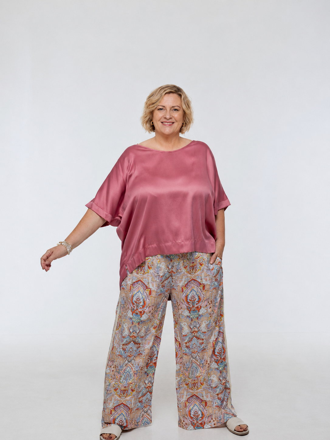 Woman wearing printed Rimini Pant. Wide leg style, relaxed fit, Braided Trim side stripe.