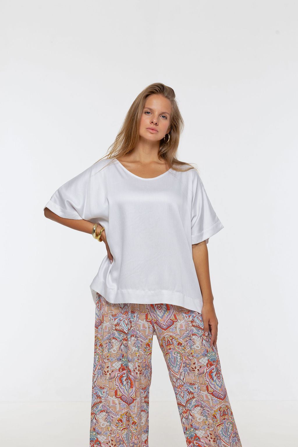 Woman wearing Salina Top in White Sand - Luxe Satin. Relaxed fit, elbow length Dolman sleeve