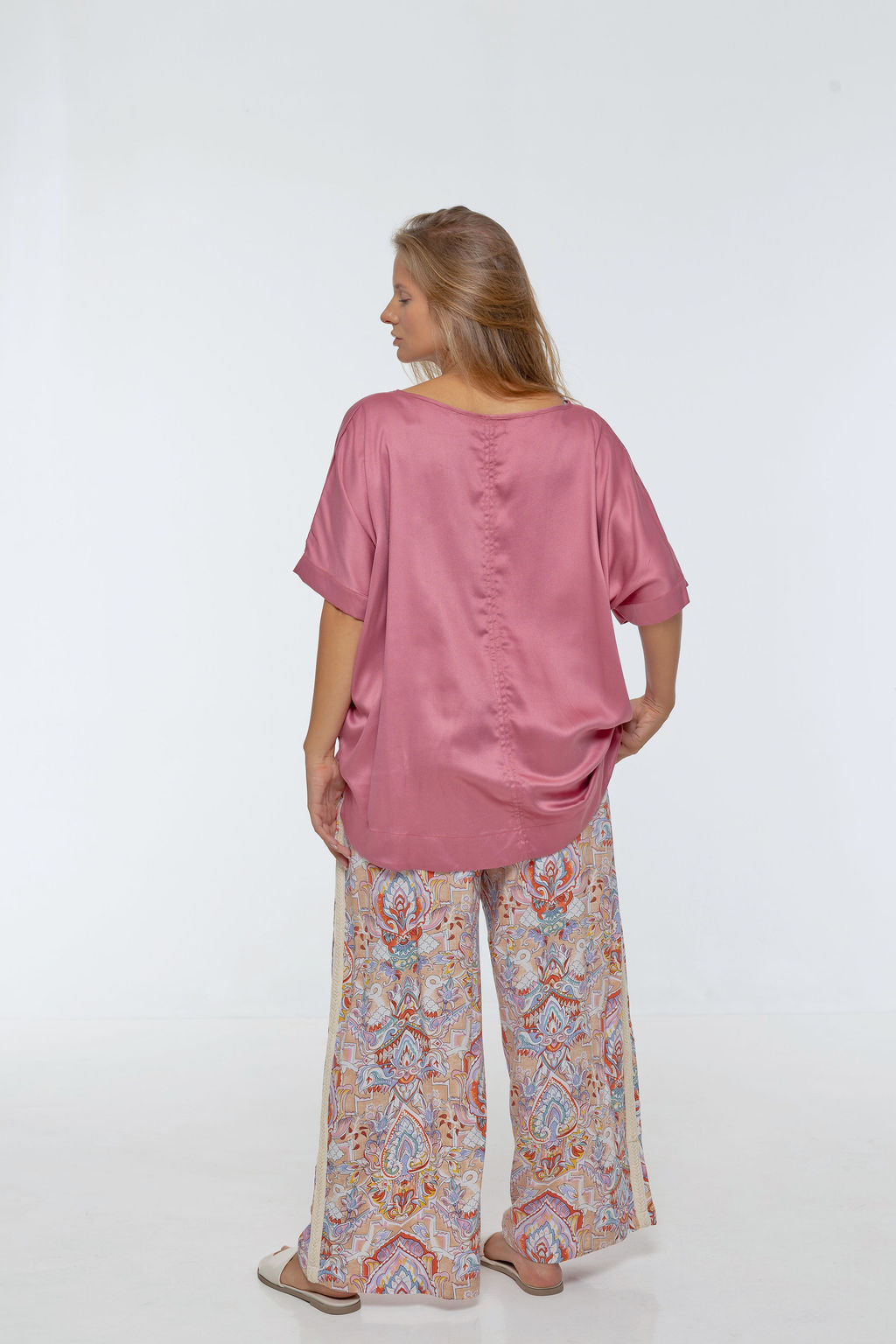 Woman wearing Salina Top in Dusted Pink - Luxe Satin. Relaxed fit, elbow length Dolman sleeve