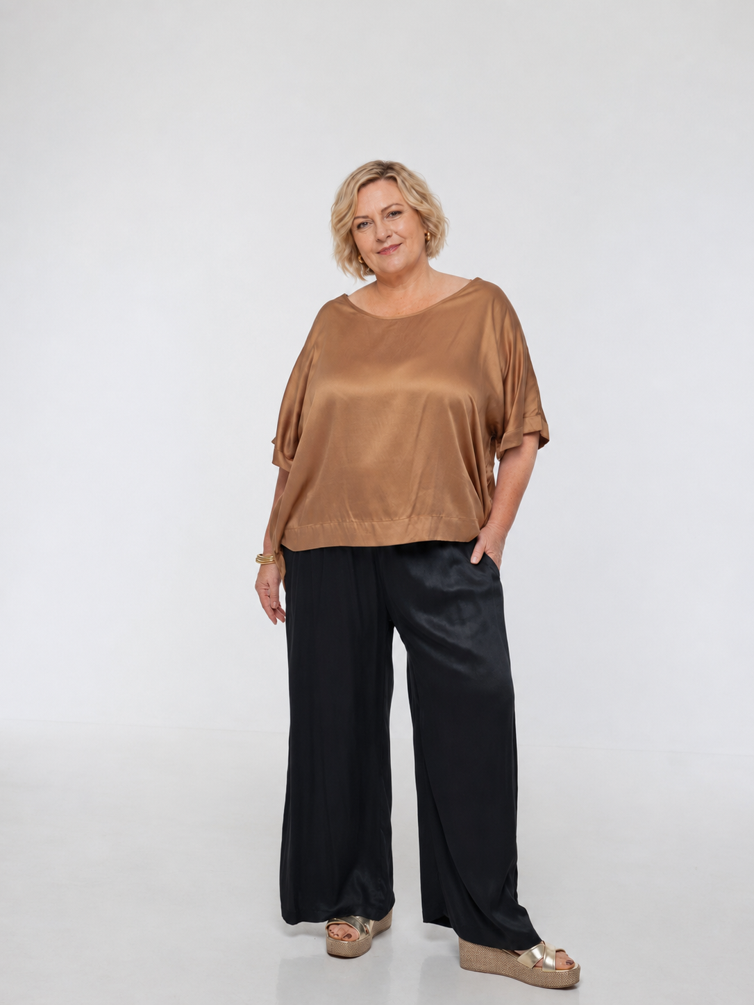 Woman wearing Salina Top in Walnut - Luxe Satin. Relaxed fit, elbow length Dolman sleeve