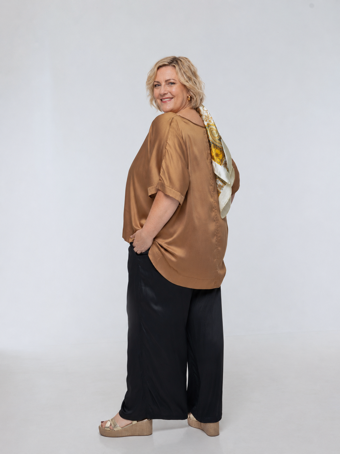 Woman wearing Salina Top in Walnut - Luxe Satin. Relaxed fit, elbow length Dolman sleeve