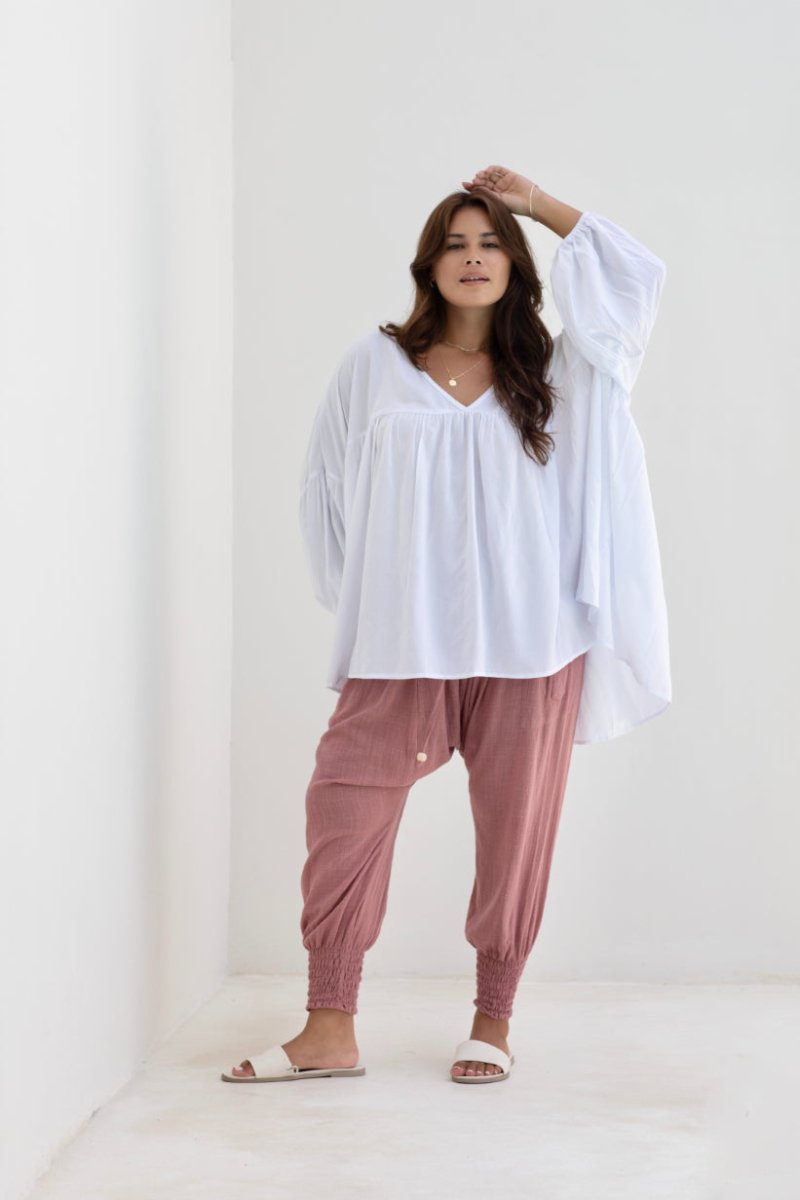 Woman wearing Moroccan Pant in Pink Clay. Harem style, relaxed fit, with shirred elastic cuff.