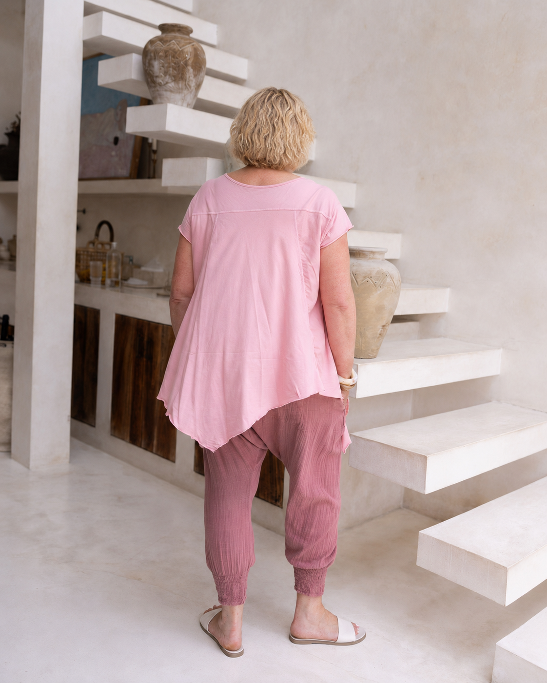 Woman wearing Moroccan Pant in Pink Clay.  Harem style, relaxed fit, with shirred elastic cuff.