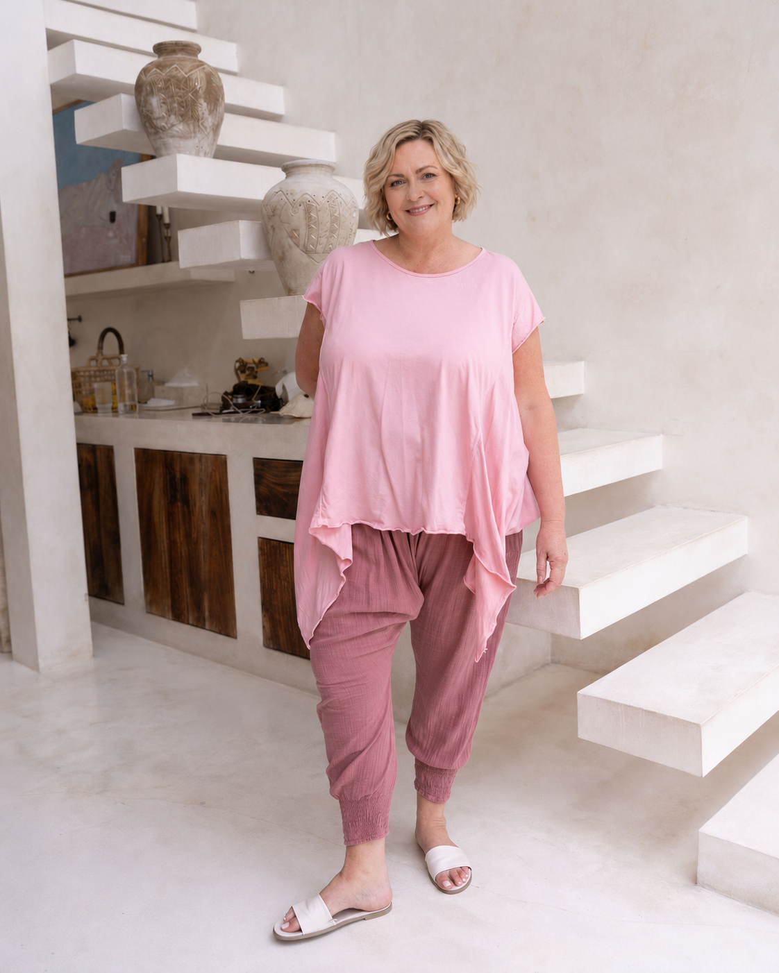 Woman wearing Moroccan Pant in Pink Clay.  Harem style, relaxed fit, with shirred elastic cuff.