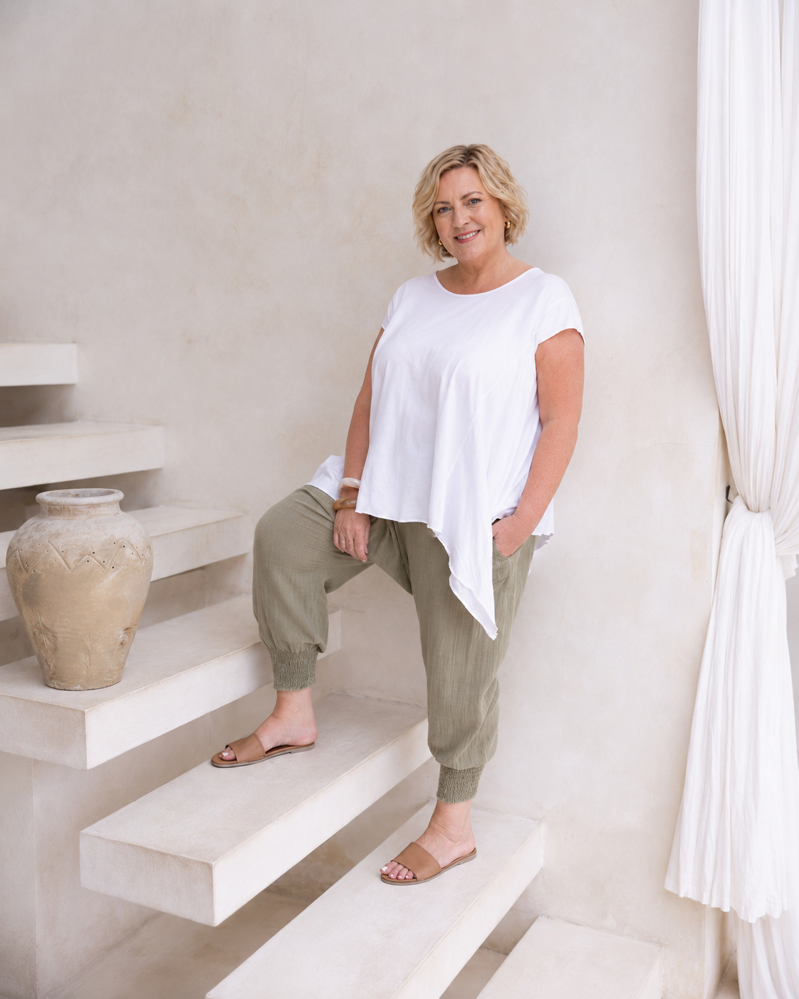 Woman wearing Moroccan Pant in Sage.  Harem style, relaxed fit, with shirred elastic cuff.