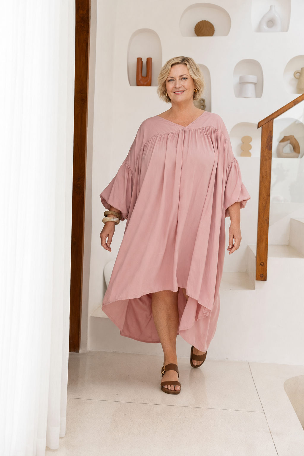 Woman wearing the Roma Dress in Dusty Pink, relaxed oversized fit, boho style