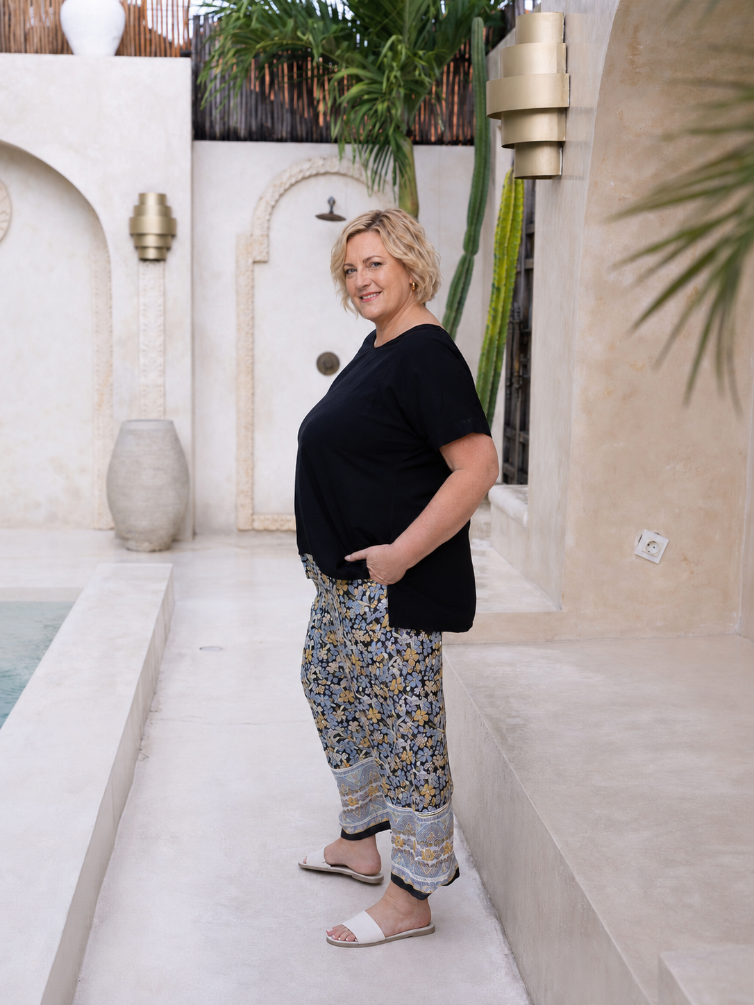 Woman wearing the Vctoria Top in Black,  Relaxed woven t-shirt in 100% soft Rayon
