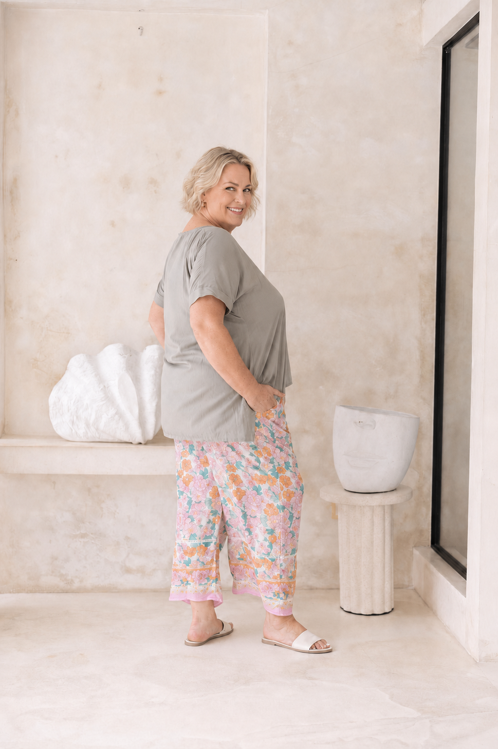Woman wearing the Vctoria Top in Sage.  Relaxed woven t-shirt in 100% soft Rayon
