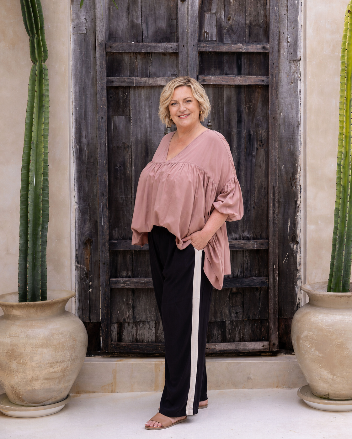 Woman wearing the Perfect Tuxedo Pant in Black with Stone Stripe, fluid wide-leg fit, effortlessly elevated style