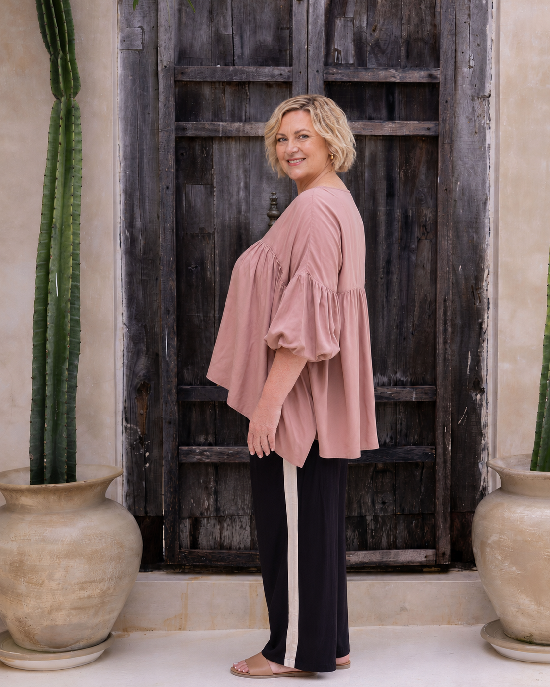 Woman wearing the Perfect Tuxedo Pant in Black with Stone Stripe, fluid wide-leg fit, effortlessly elevated style