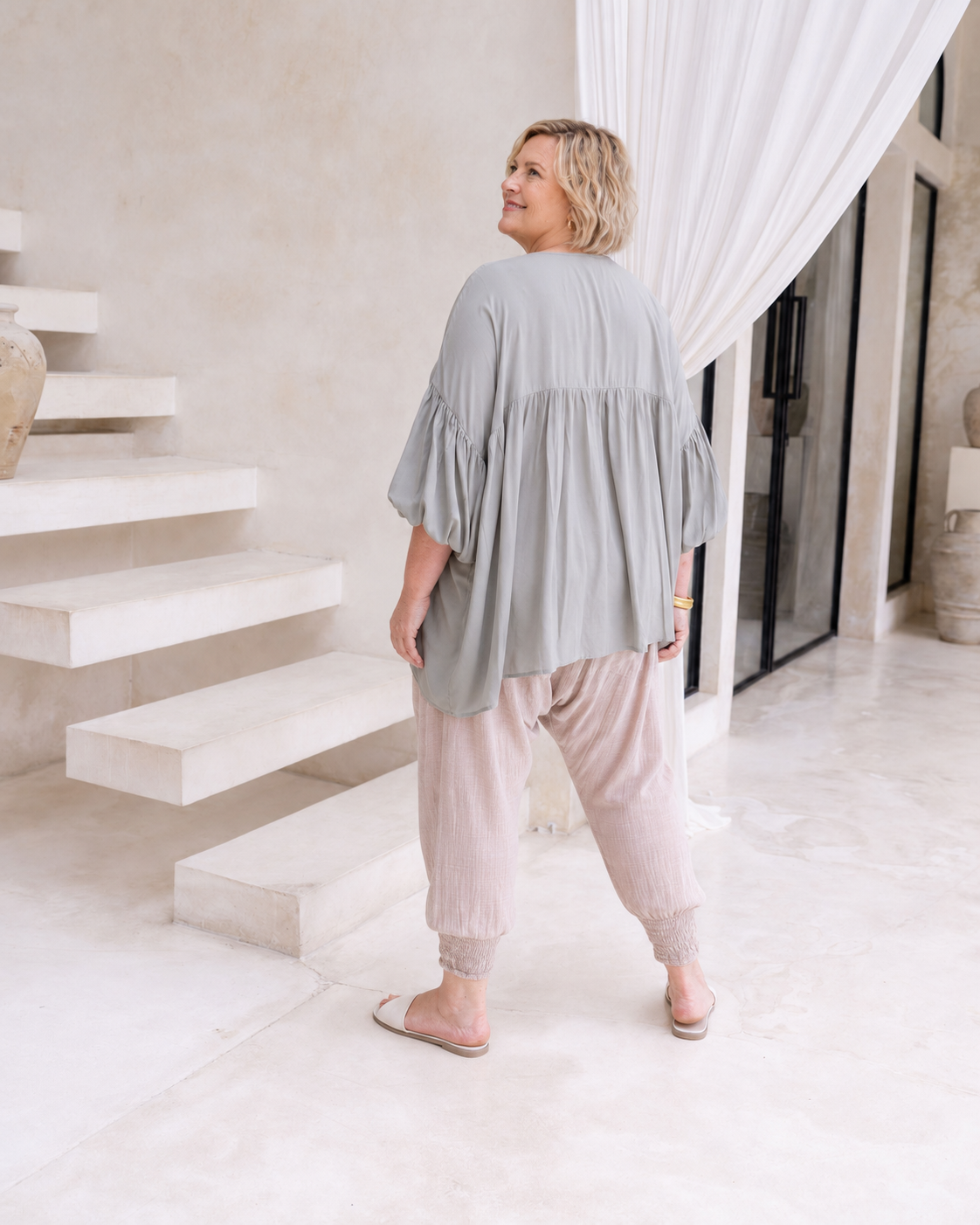 Woman wearing the Florence Top in Sage, relaxed oversized fit, boho style