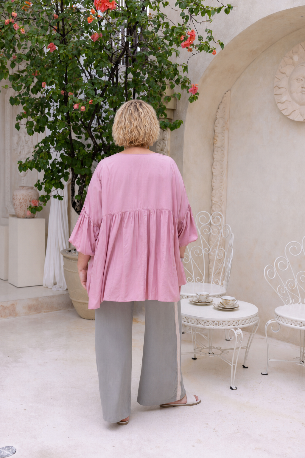 Woman wearing the Perfect Tuxedo Pant in Sage with Stone Stripe, fluid wide-leg fit, effortlessly elevated style