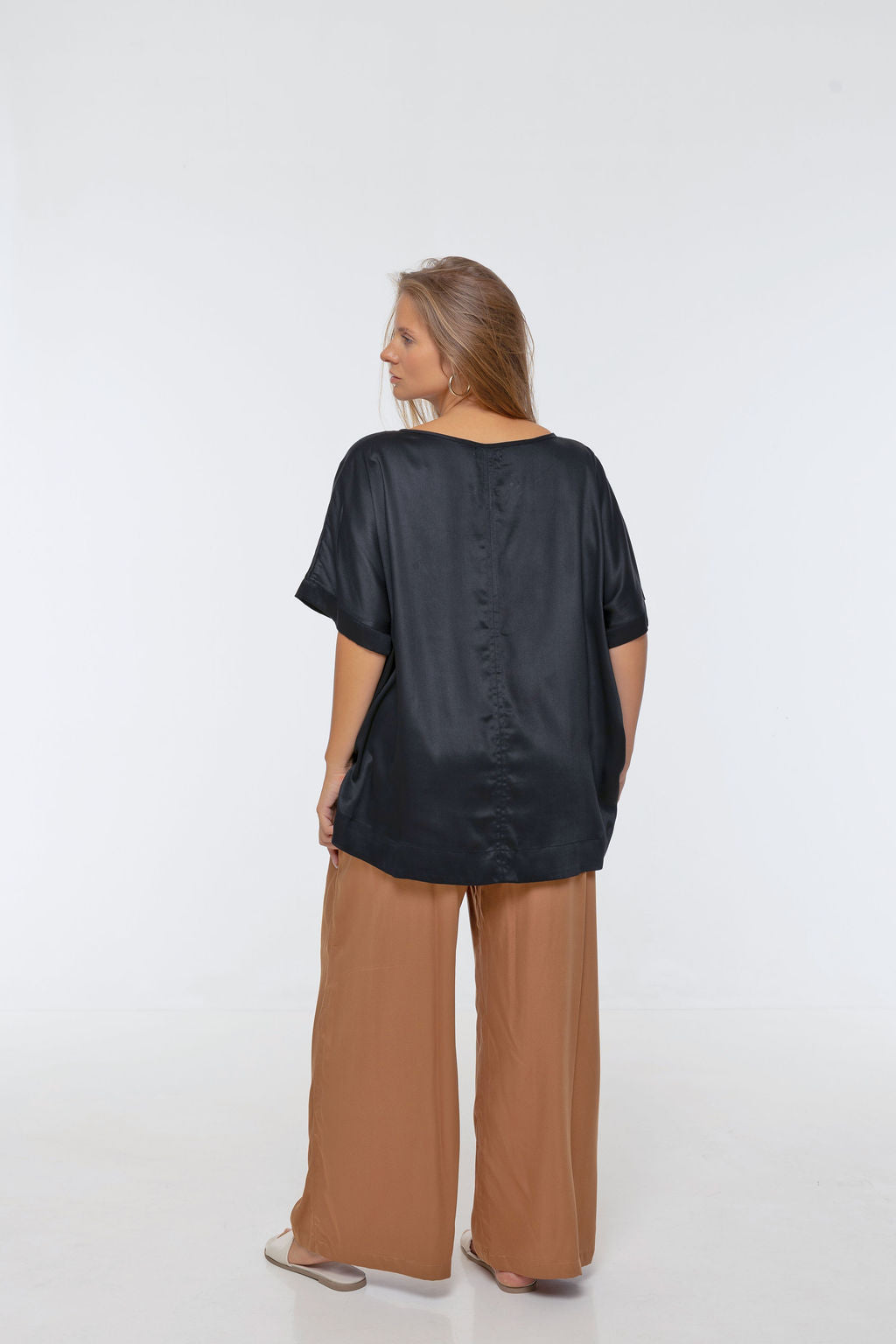 Woman wearing Rimini Pant in Walnut - Luxe Satin.  Wide leg style, relaxed fit.