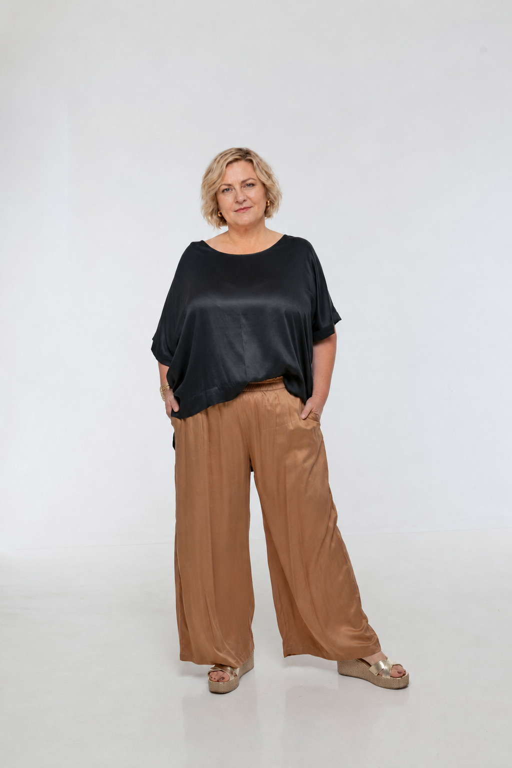 Woman wearing Rimini Pant in Walnut - Luxe Satin.  Wide leg style, relaxed fit.