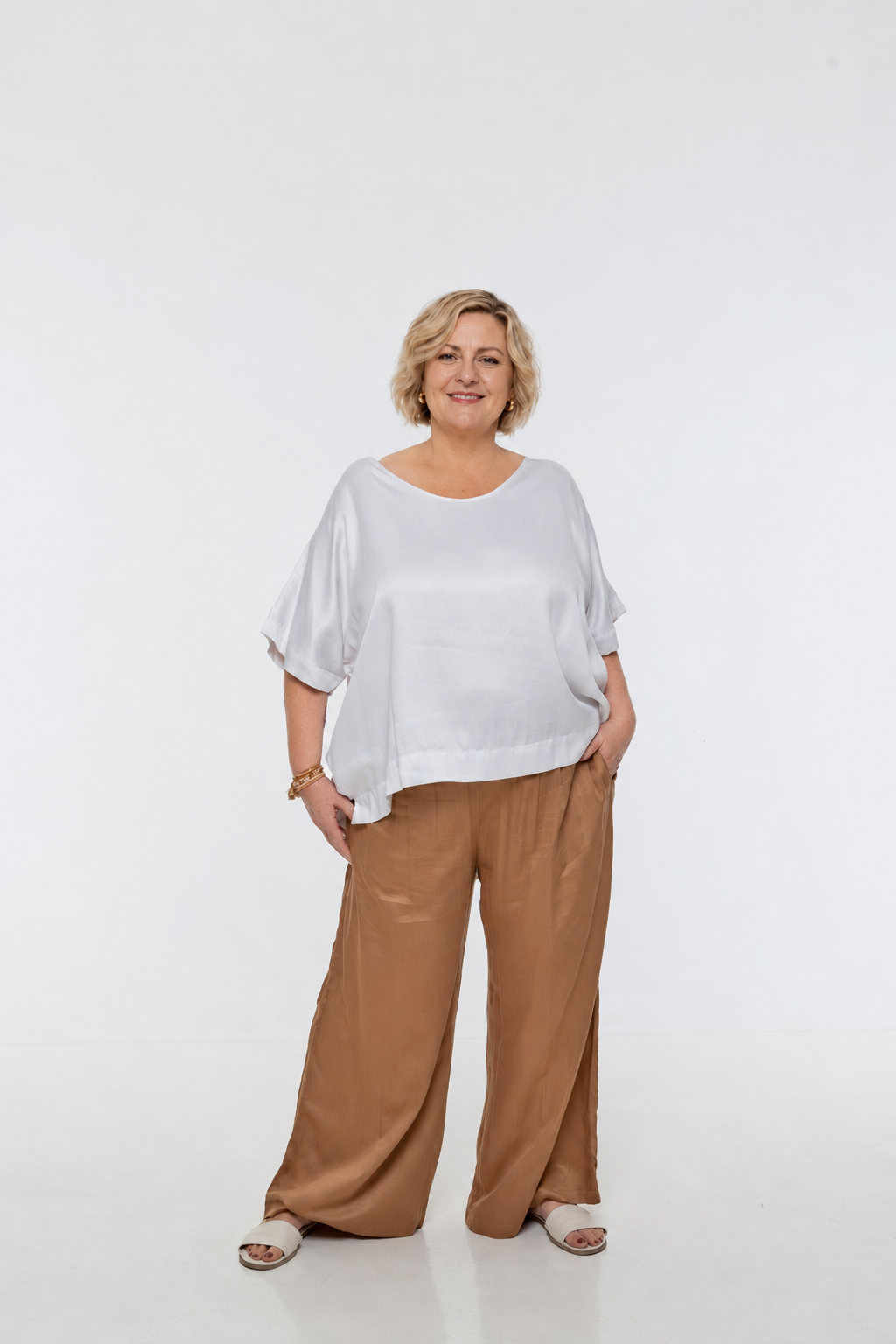 Woman wearing Rimini Pant in Walnut - Luxe Satin.  Wide leg style, relaxed fit.