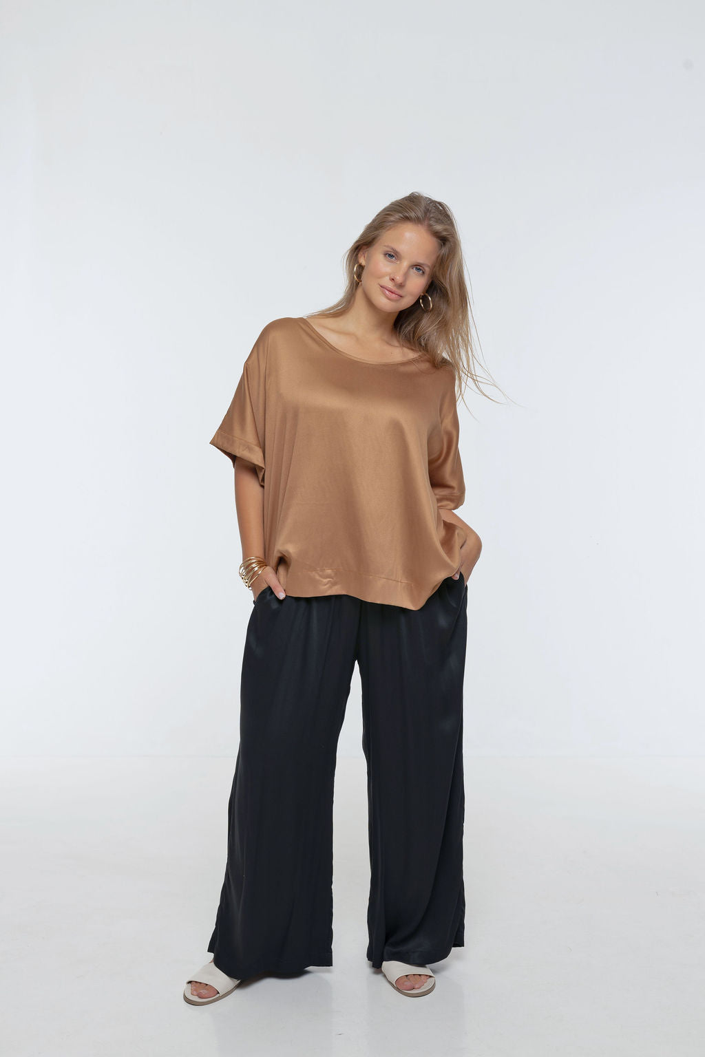 Woman wearing Rimini Pant in Dusty Pink - Luxe Satin.  Wide leg style, relaxed fit.