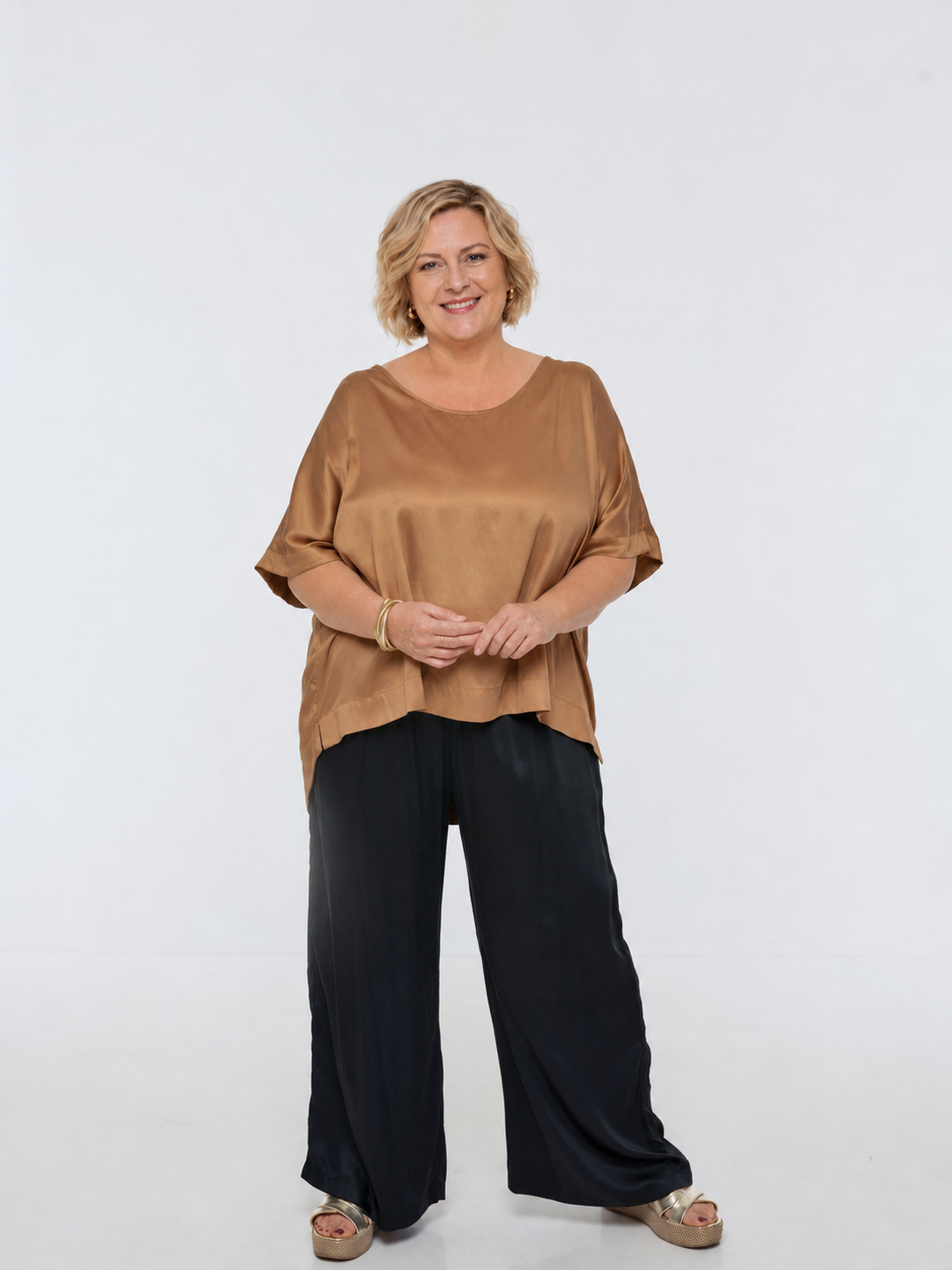 Woman wearing Rimini Pant in Black - Luxe Satin.  Wide leg style, relaxed fit.
