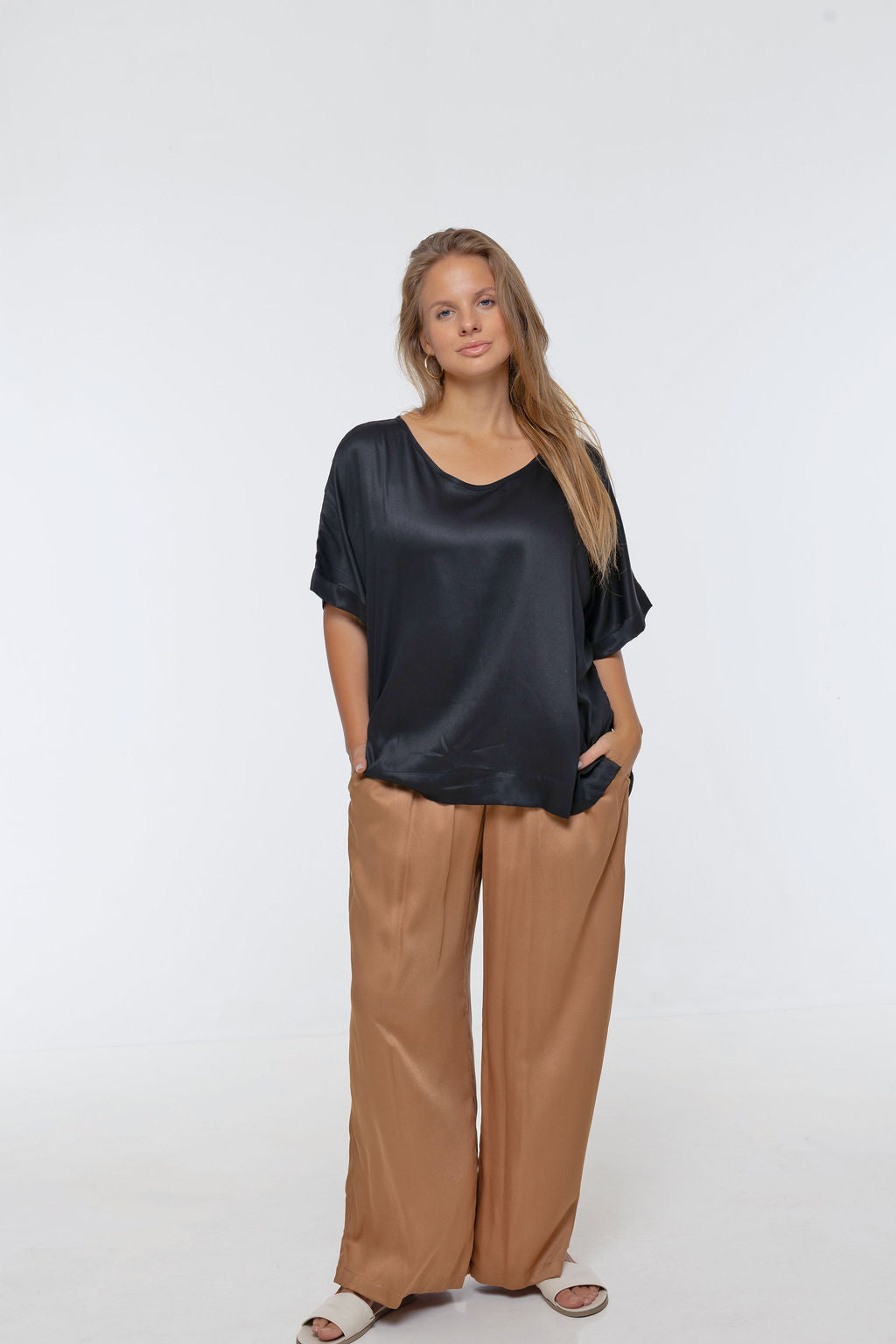Woman wearing Salina Top in Black - Luxe Satin.  Relaxed fit, elbow length Dolman sleeve 