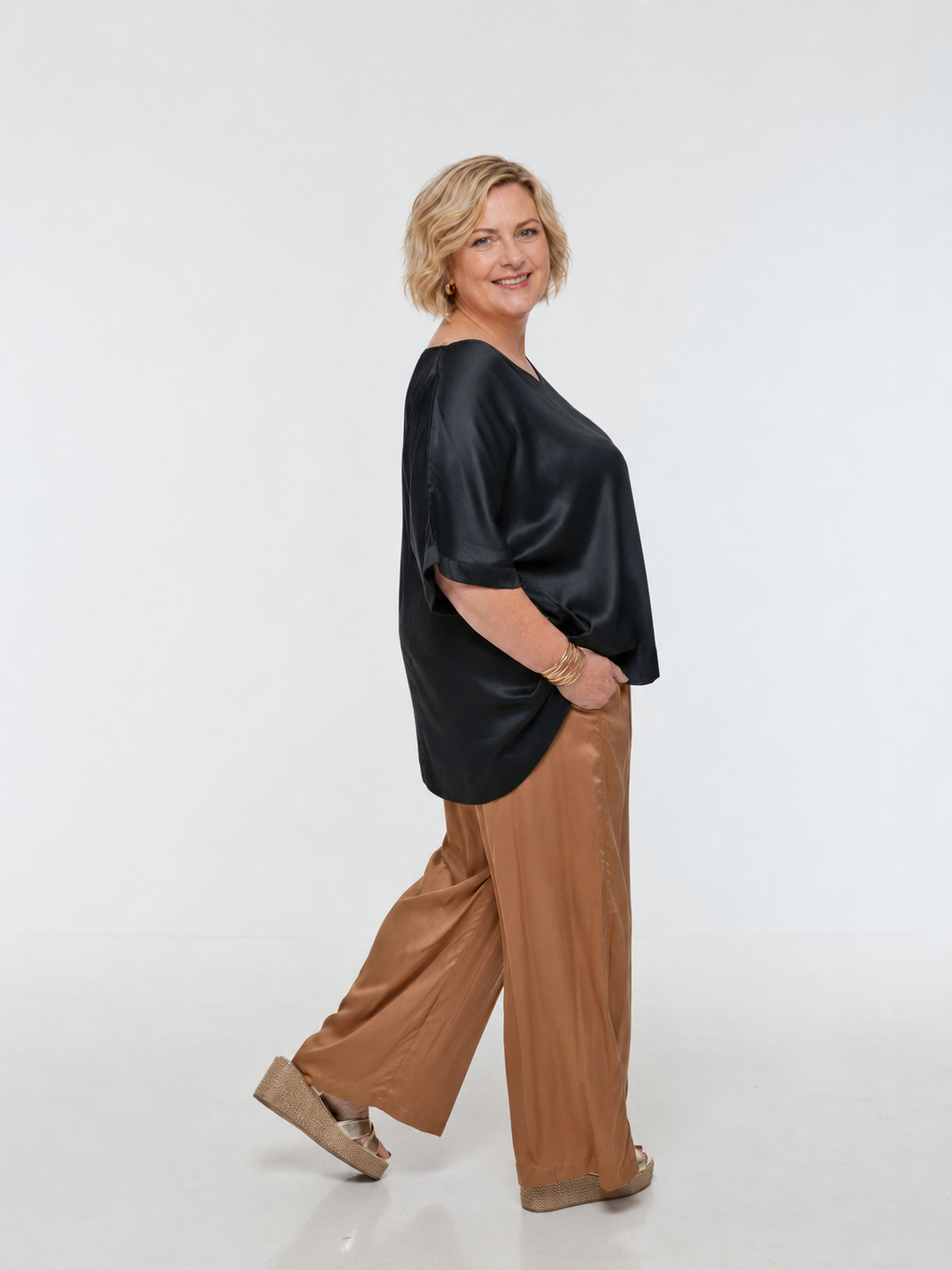Woman wearing Salina Top in Black - Luxe Satin.  Relaxed fit, elbow length Dolman sleeve 