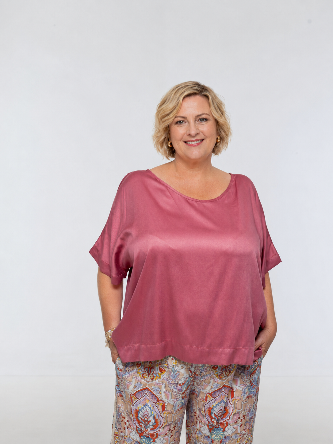 Woman wearing Salina Top in Dusted Pink - Luxe Satin.  Relaxed fit, elbow length Dolman sleeve 