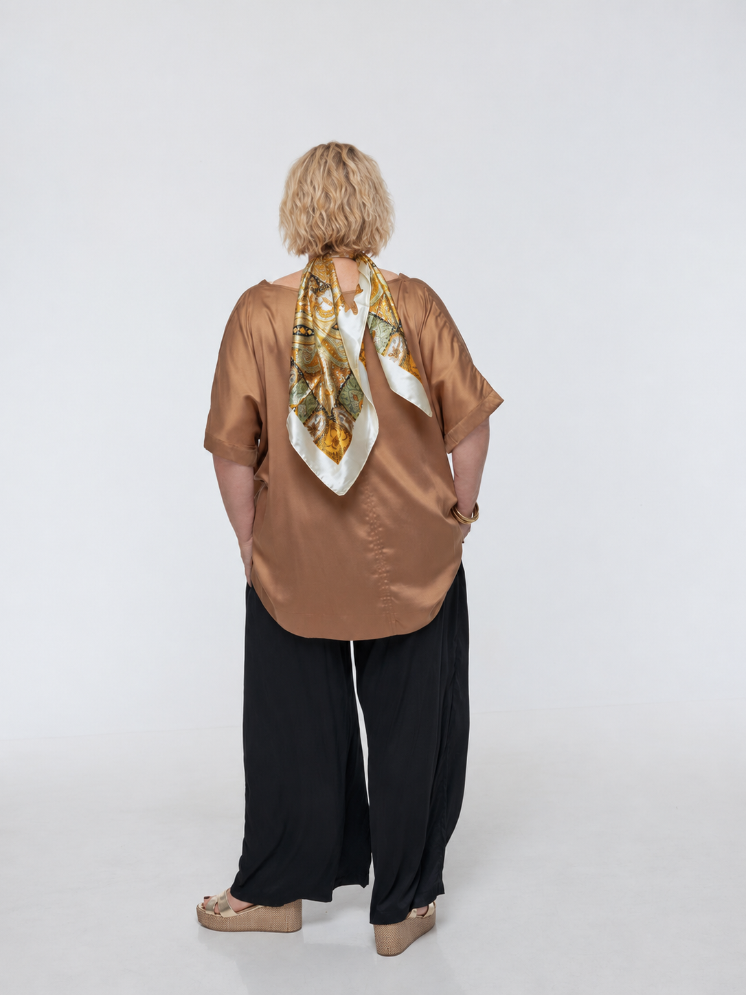 Woman wearing Salina Top in Walnut - Luxe Satin.  Relaxed fit, elbow length Dolman sleeve 