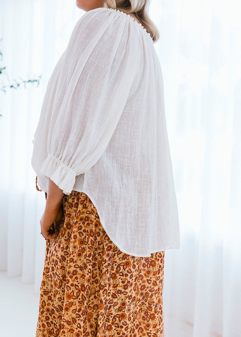Salt and Soda Design For Every Season Every Body Every Day Ouvea Blouse Ivory Muslin 100% Muslin Organic Material Australian Womens Ethical Fashion Label Off Shoulder Blouse with Raw Tassel Detail Tie and Frill Sleeves